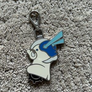 Prada shield bag accessory.